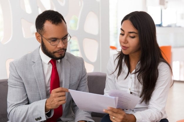 a man discussing with his colleague about the use of artificial intelligence in legal services